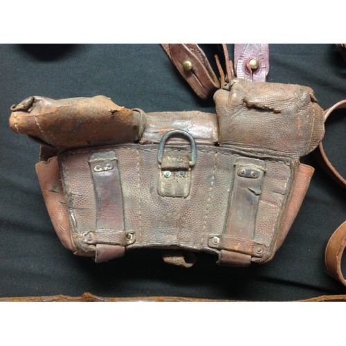 144 - WW2 British / US / German leatherwork collection to comprise of: two leather shoulder holsters, both... 