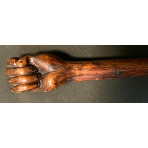 53 - A Boer war period prisoner of war walking stick, carved as a clenched fist, inscribed 1912, Bermuda,... 