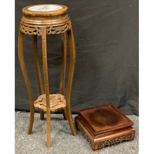 89 - A carved Chinese two tier jardiniere stand, stone inset top, floral under tier, 84cm high, 26cm diam... 