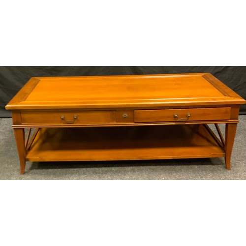 90 - A contemporary coffee table, over-sailing rectangular top above a pair of drawers, rectangular under... 