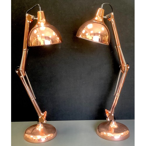 101A - A pair of contemporary gilt metal angle poise type side lights