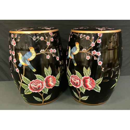 87A - A pair of contemporary Chinese conservatory barrel seats, decorated with fanciful birds and prunus b... 