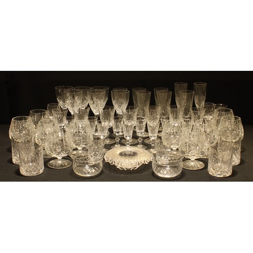 208 - Glassware - a quantity of cut glass including wines glasses, champagne flutes, brandy balloons, etc