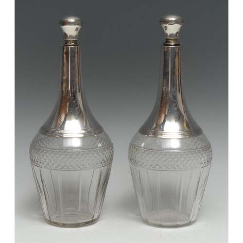 142 - A pair of French silver mounted clear glass mallet shaped decanters, each with central hobnail-cut b... 