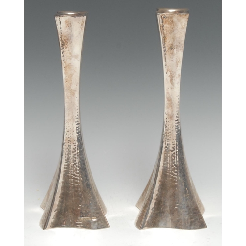 153 - A pair of Modernist silver candlesticks, planished overall, 22.5cm high, Hazorfim, Israel, marked 92... 