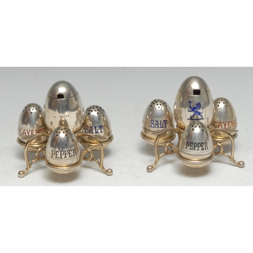 157 - A pair of Victorian silver and enamel trefoil cruets, each with an arrangement of egg shaped condime... 