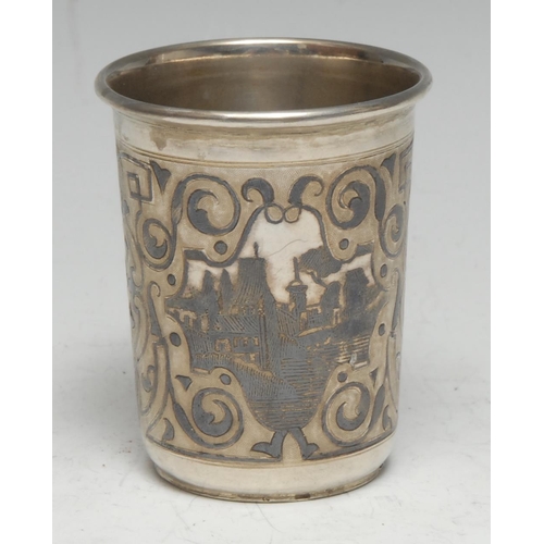 163 - A Russian silver and niello tapered cylindrical beaker, decorated with townscape vignettes and strap... 