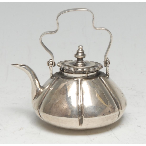 197 - An 18th century Dutch silver miniature toy kettle, 6cm over shaped swing handle, c.1775