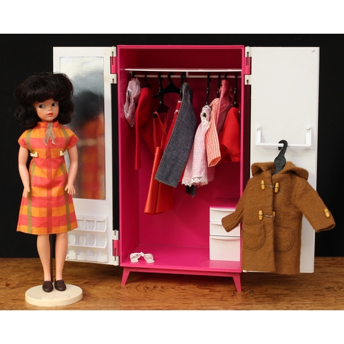 2048 - A 1960's Sindy doll, dark brunette bubble shaped hair, side glancing blue eyes, wearing a chequered ... 