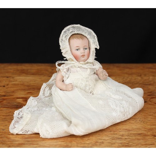 2053 - A German all bisque jointed miniature character baby doll, painted blue glass eyes and features incl... 