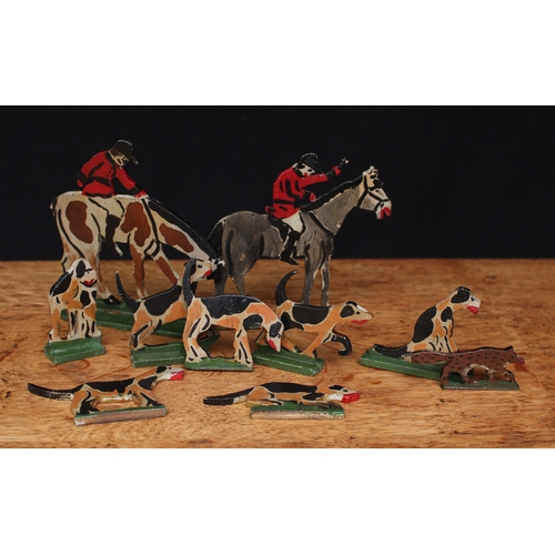 2064 - English Folk Art - a 1930's painted wooden hunting set, comprising of two mounted huntsmen, seven ho... 