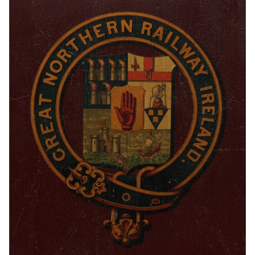 2078 - Railwayana, Irish Interest - a plywood 'coach panel', maroon painted bearing the arms of the Great N... 