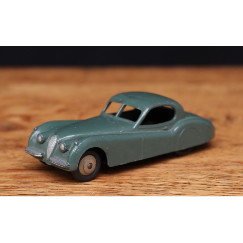 2110 - Dinky Toys 157 Jaguar XK120, drab green body, fawn ridged hubs, unboxed, this example is casted with... 
