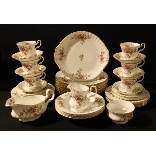 79 - A Royal Albert Moss Rose pattern dinner and tea service, dinner plates, sauce boat, tecups and sauce... 