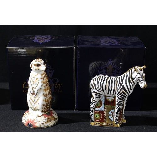 93 - A Royal Crown Derby paperweight, Meerkat, gold stopper, boxed; another, Baby Zebra, gold stopper, bo... 