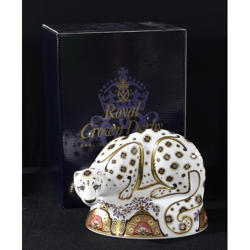 97 - A Royal Crown Derby paperweight, Snow Leopard, gold stopper, 17cm wide, printed mark, signed in gold... 