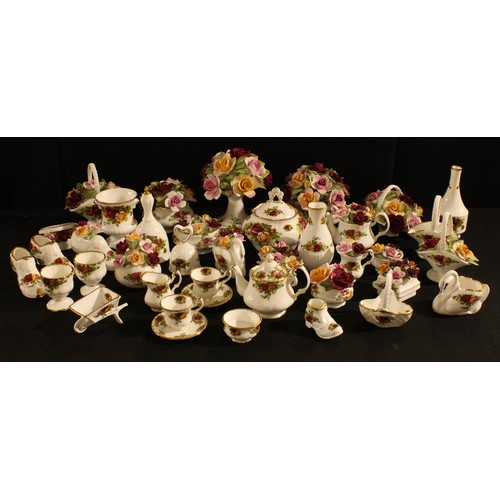 103 - A Royal Albert Old Country Roses pattern miniature teapot, milk jug, sugar bowl, pair of teacups and... 