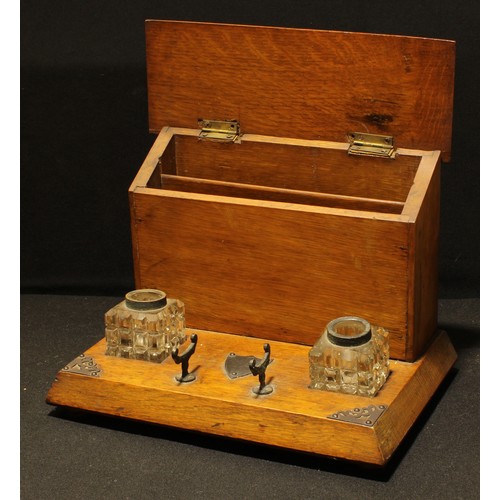 168 - A late Victorian oak desk top combination inkstand and stationery box, 1900