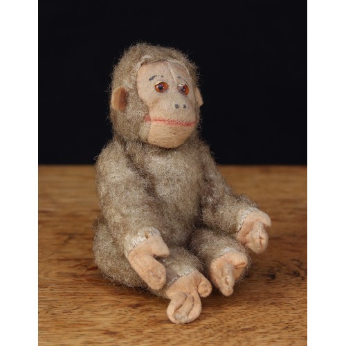 2141 - A 1930's Schuco style novelty brown mohair and cream felt miniature straw filled jointed Monkey, cre... 