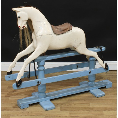 2013 - An early 20th century English rocking horse on safety stand, the carved, gesso and white painted hor... 