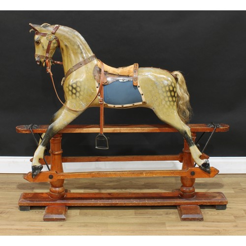 2152 - A late 19th/early 20th century English rocking horse on safety stand, probably by F H Ayres, the car... 