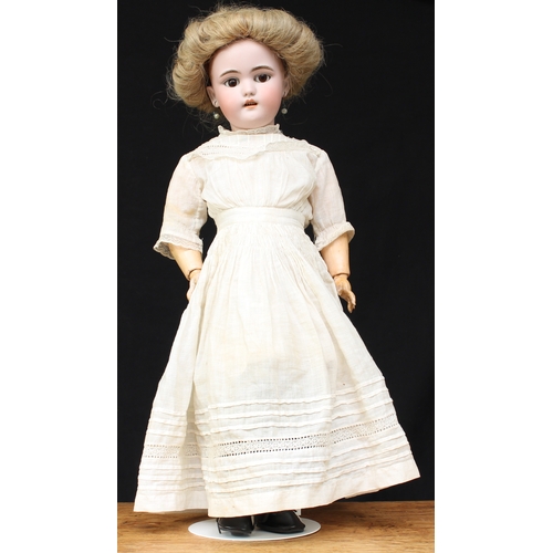 2167 - A Simon & Halbig (Germany) bisque head and painted composition bodied doll, weighted brown glass sle... 