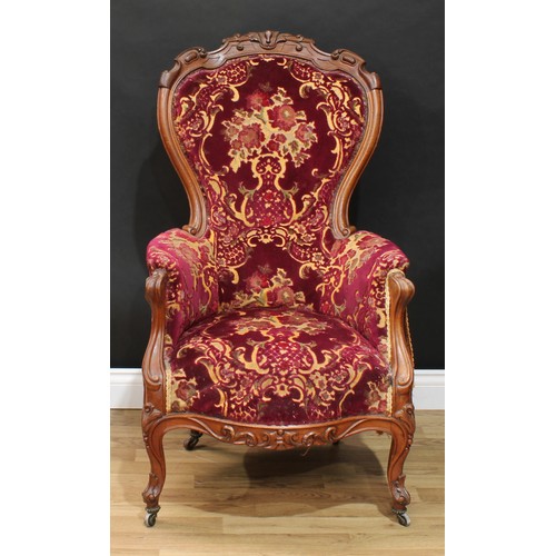 116 - A Victorian spoon back drawing room chair, 111cm high, 65cm wide, the seat 42cm wide and 38cm deep