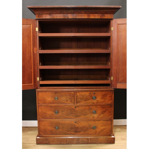 119 - A Victorian mahogany linen press, concave moulded cornice above a pair of arched panel doors enclosi... 