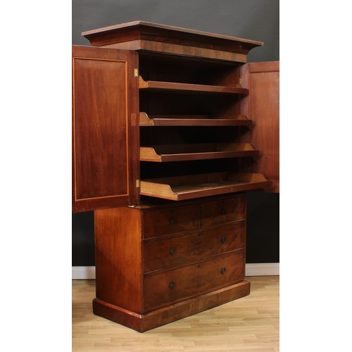 119 - A Victorian mahogany linen press, concave moulded cornice above a pair of arched panel doors enclosi... 