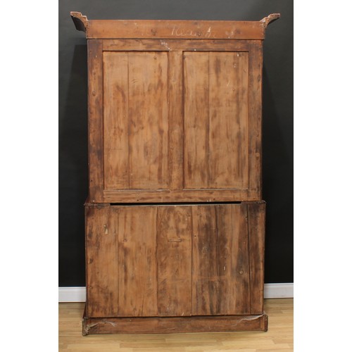 119 - A Victorian mahogany linen press, concave moulded cornice above a pair of arched panel doors enclosi... 