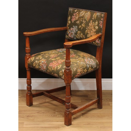 123 - A set of six Cromwellian Revival oak dining chairs, comprising a pair of carvers and six side chairs... 