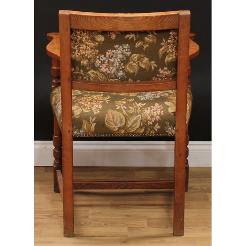 123 - A set of six Cromwellian Revival oak dining chairs, comprising a pair of carvers and six side chairs... 