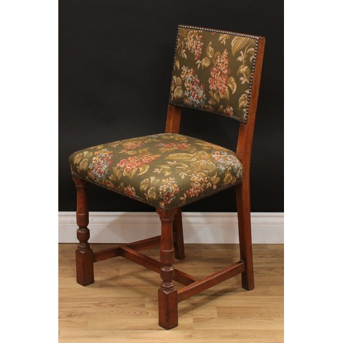 123 - A set of six Cromwellian Revival oak dining chairs, comprising a pair of carvers and six side chairs... 