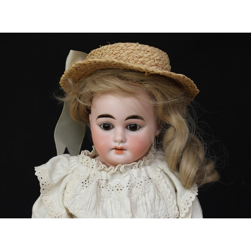 2223 - An Armand & Marseille (Germany) bisque shoulder head and part kid leather/painted bisque bodied doll... 