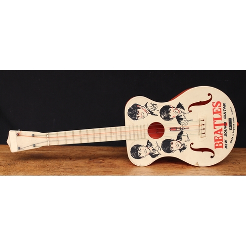 2228 - A 1960’s Selcol Beatles new sound novelty toy guitar, four strings, the upper bout decorated with il... 