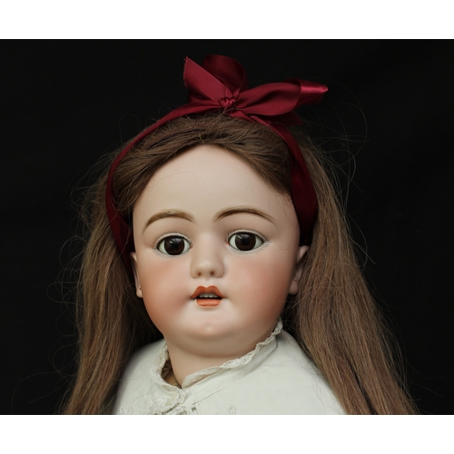 2233 - A large Simon & Halbig (Germany) bisque head and painted composition bodied doll, weighted brown gla... 