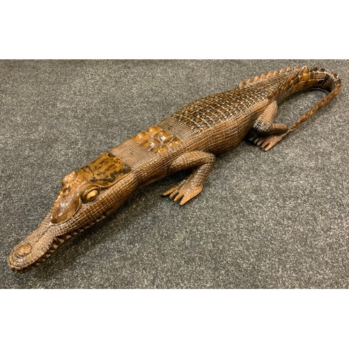 159 - Papua New Guinea side table, collapsible base, 68cm wide;  a hardwood crocodile