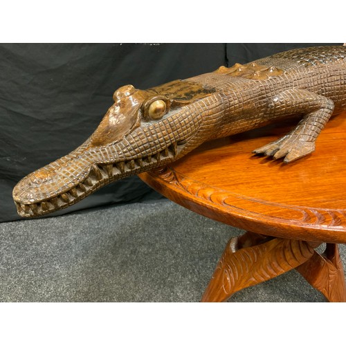 159 - Papua New Guinea side table, collapsible base, 68cm wide;  a hardwood crocodile