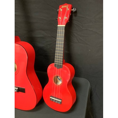 205 - A Yamaha F-310 six string acoustic guitar;  Mahalo U30G red Ukulele;  a childs Palma PJROFT guitar, ... 