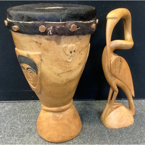 279 - Tribal items - an African drum, from VENDA,  57cm high;  a wooden stork (2)