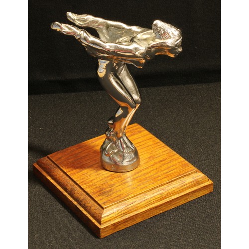 71 - A chrome car mascot, female winged form in flight, stepped square wooden base, 15cm