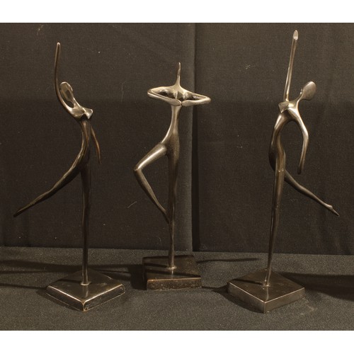 77 - A set of three bronzed abstract dancing figures, Design Bodrul Khalique, two with paper labels, appr... 