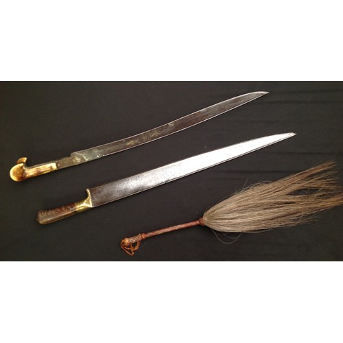 67 - Pair of Indo-Persian Short Swords and a Horse hair fly swatter. First Sword has a ear style grip wit... 