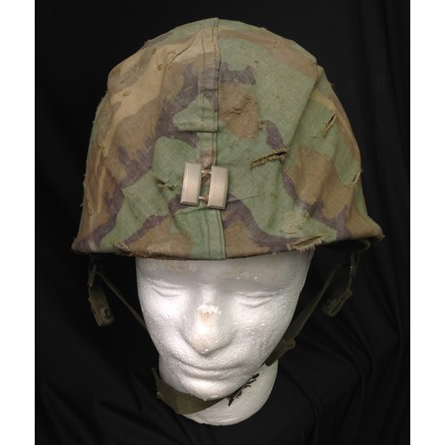 178 - US M1 Steel Helmet complete with liner and 1980's Woodland Pattern Camo cover to which is pinned and... 