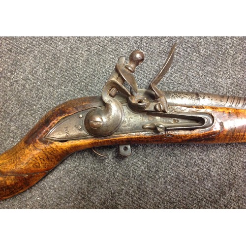 181 - Indian Flintlock Musket with 835mm long smooth bore twisted steel barrel. Working action. Lock is Ea... 