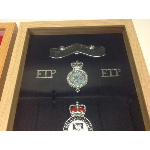 201 - Professionaly framed displays of Police badges: West Mercia Constabulary cap badges, buttons and clo... 