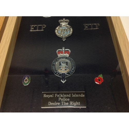 201 - Professionaly framed displays of Police badges: West Mercia Constabulary cap badges, buttons and clo... 