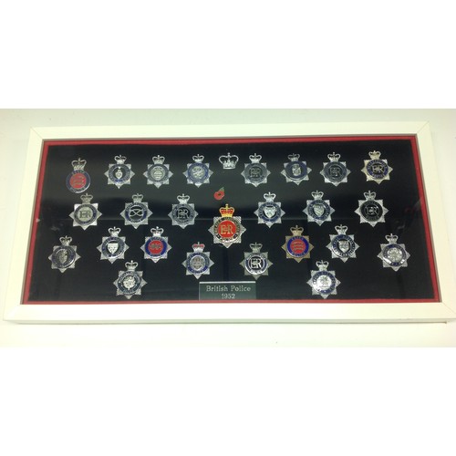 203 - A collection of framed British Police cap badges entitled 