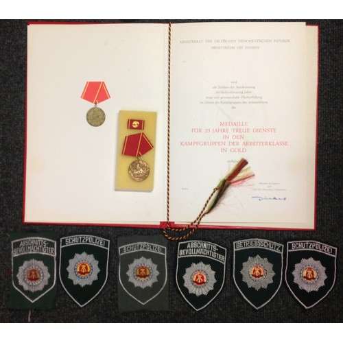 214 - West German Police insignia comprising of sleeve insignia, 13 pocket fob insignias, shoulder boards ... 