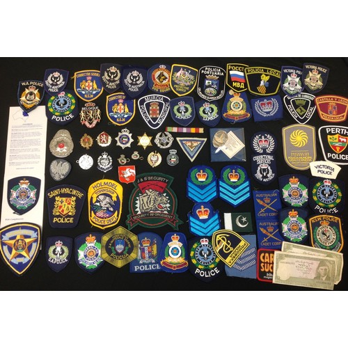 215 - A collection of World Police cloth insignia to include Australia, New Zealand, Spain, Russia, Poland... 